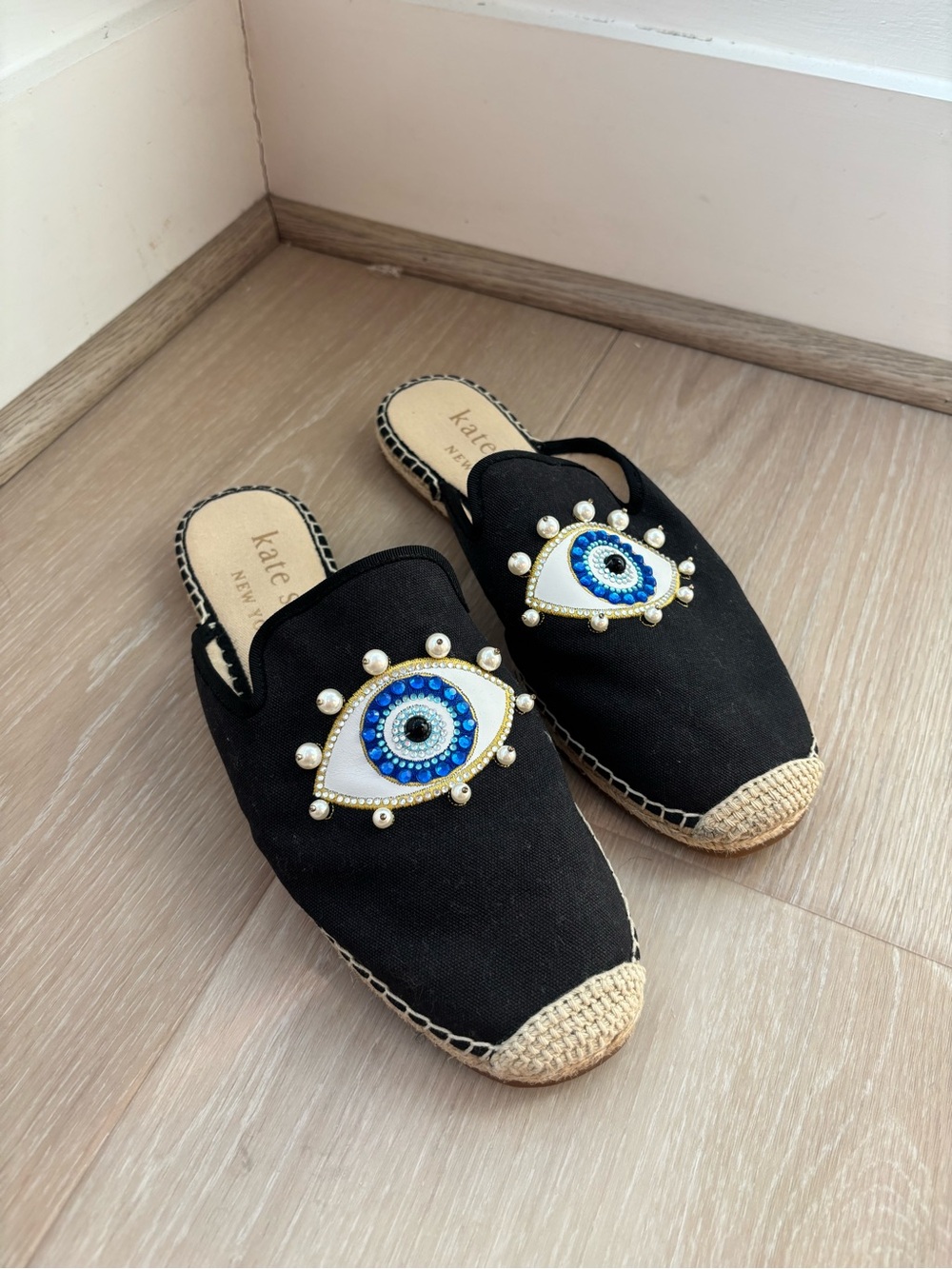kate spade Black Espadrille Mules with Blue Eye Embellishment